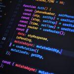 Close-up of vibrant JavaScript code for web development with ReactJS and Tailwind CSS.