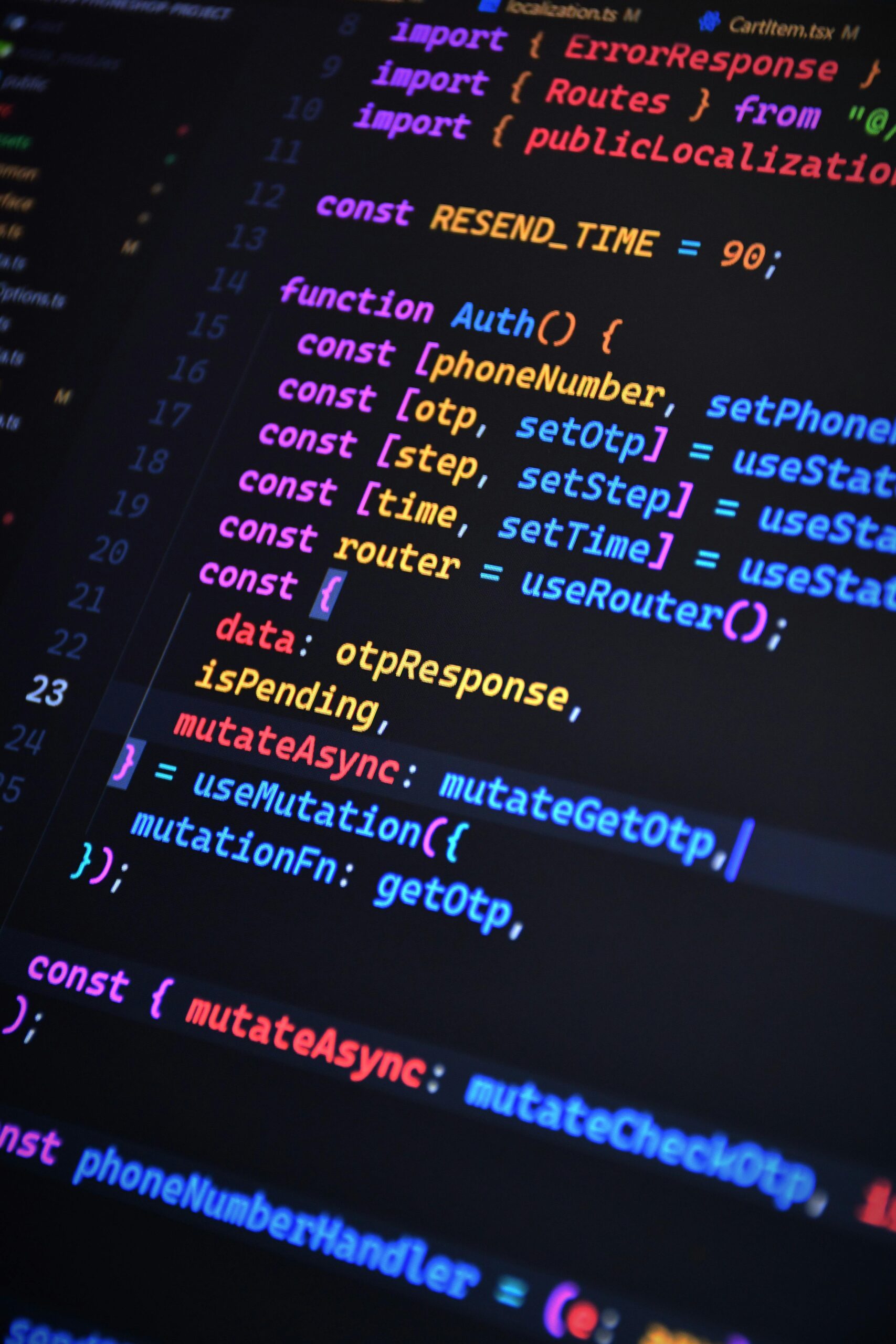 Close-up of vibrant JavaScript code for web development with ReactJS and Tailwind CSS.