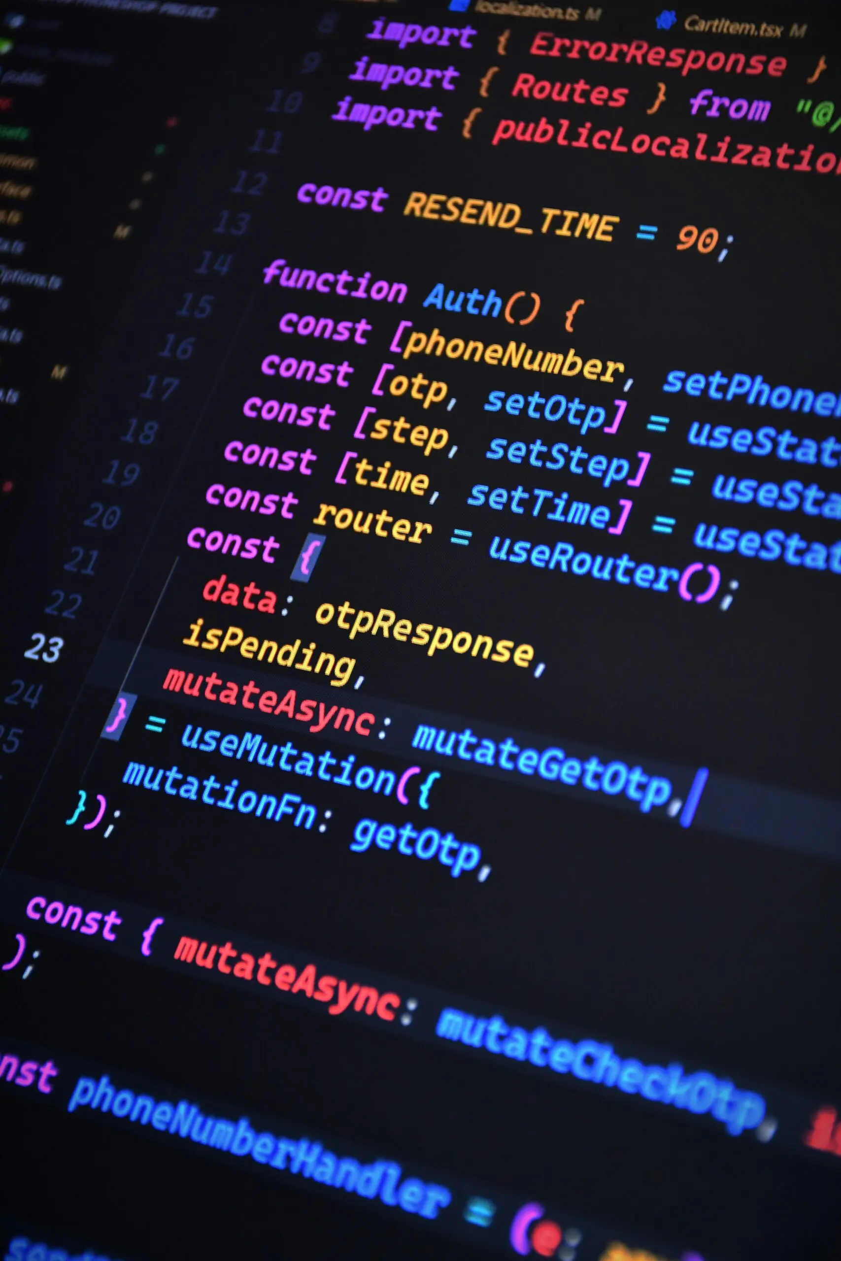 Close-up of vibrant JavaScript code for web development with ReactJS and Tailwind CSS.